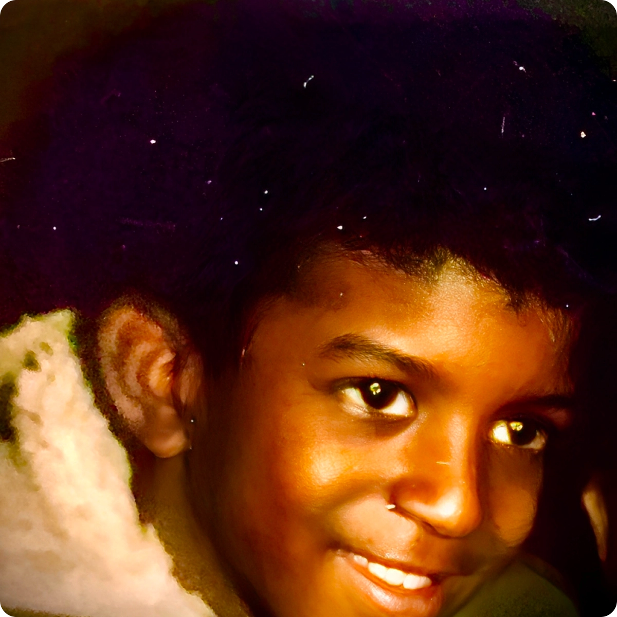 Smiling child with curly hair, close-up.